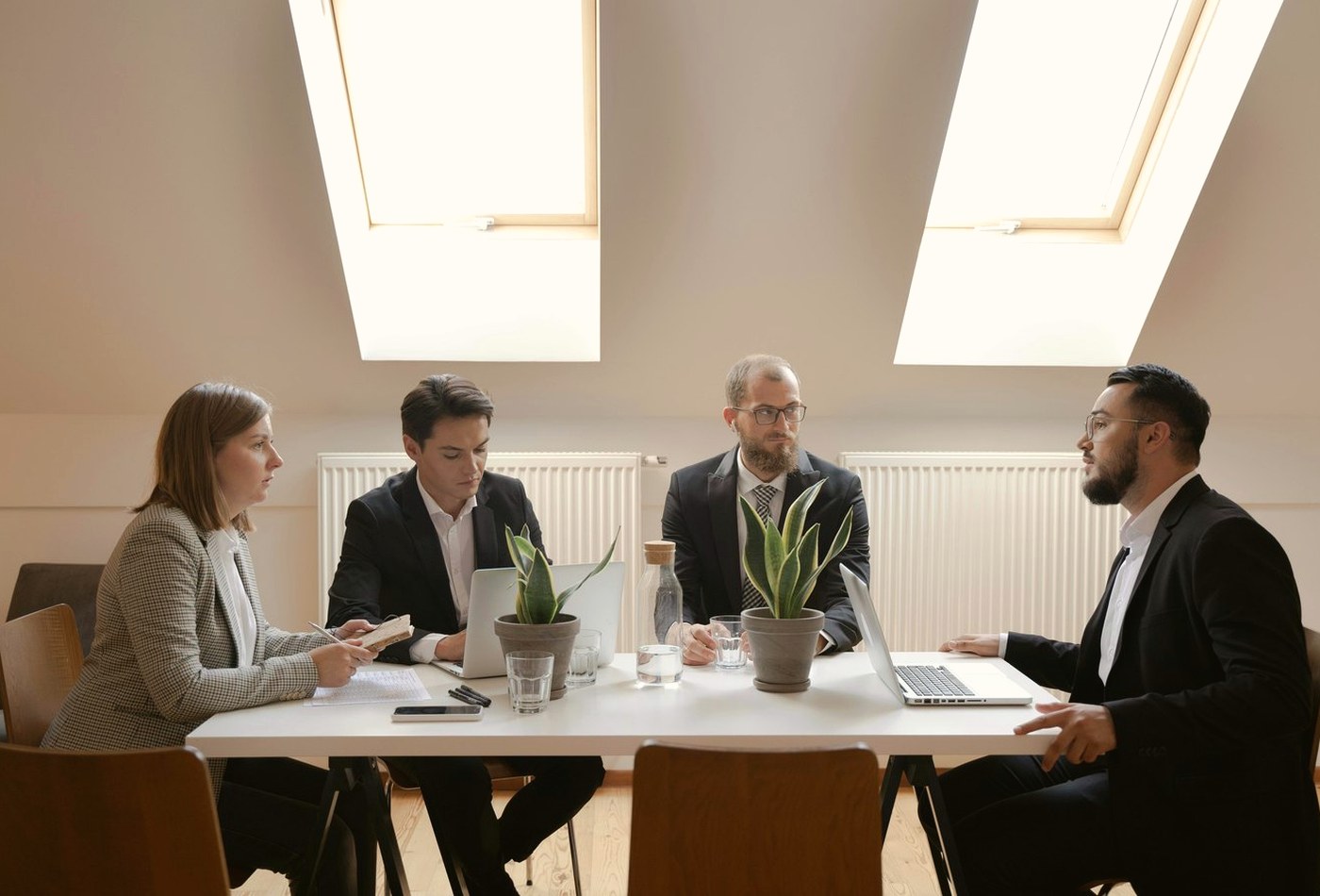 Professionals reviewing written policy information